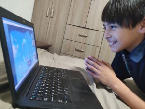Child smiling during a Fluentz Kidz learning session